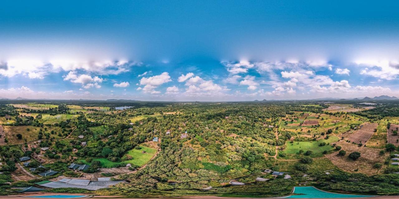 Nivadoo Resort Sigiriya Bagian luar foto View of the village from the top of the hill